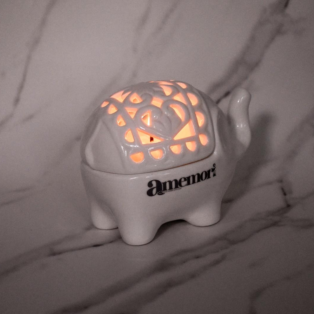 Luminous Guardian ~ Like the elephant, carry strength gently.